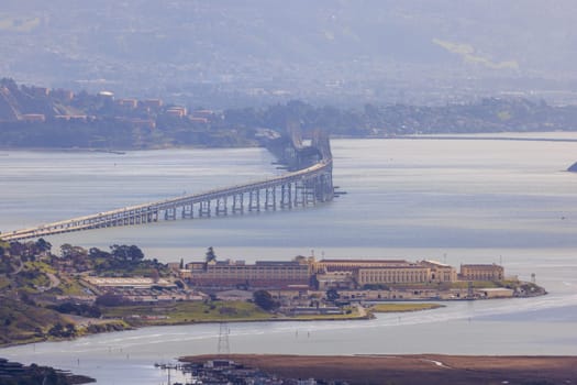 Aerial view of San Quinten Prison and Richmond - San Rafael Bridge on hazy day