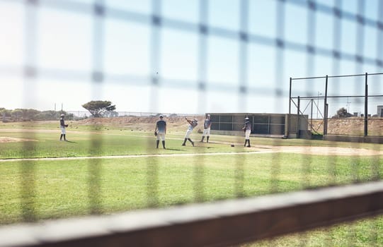 Baseball season starts now. a group of young men playing a game of baseball.