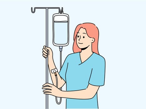Happy woman with intravenous saline drip