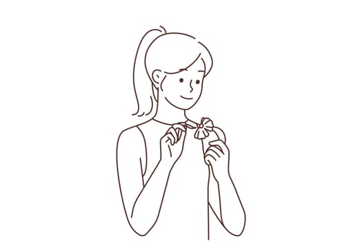 Smiling woman read fortune on chamomile
