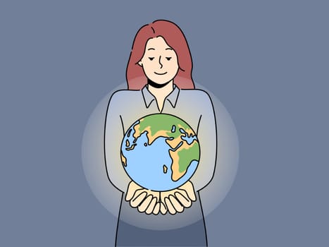 Smiling woman with planet earth in hands