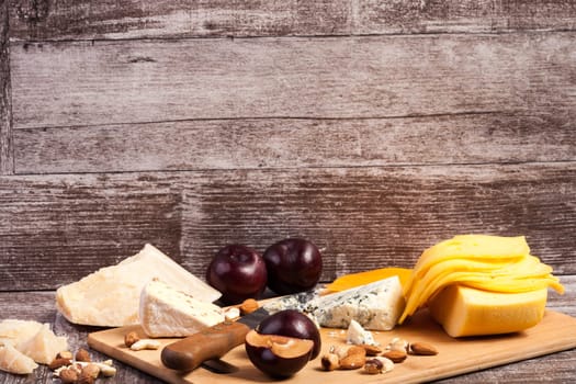 Gourmet cheese apetizer on wooden background