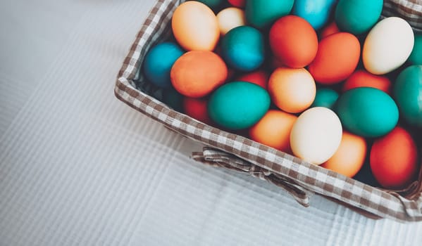 Festive basket with colorful Easter eggs