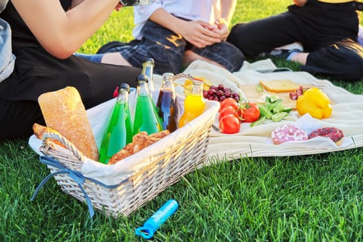 Close-up food and drink for a picnic on green grass