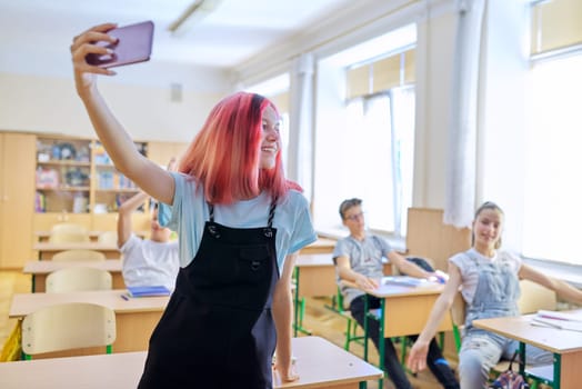 Teenagers students having fun in the classroom