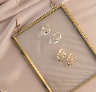 Elegant jewelry set of gold earrings. Jewelry set minimalist style. Handmade bijouterie concept.