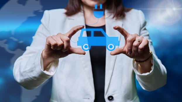Electric car sign in woman hands, green transport concept