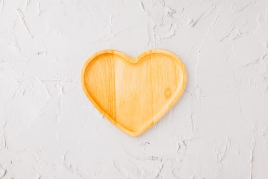 Empty heart shape wooden tray isolated