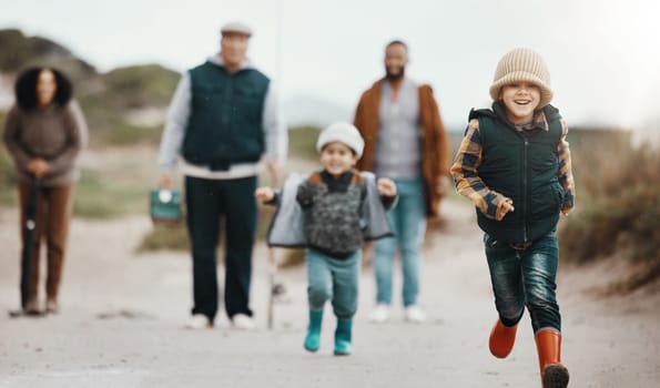 Running, excited and family at the beach for fishing, hobby and weekend activity. Carefree, freedom and children, parents and grandparents playing by the ocean and ready to catch fish for recreation