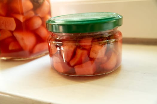 Pickled garlic in a small jar, winter stock