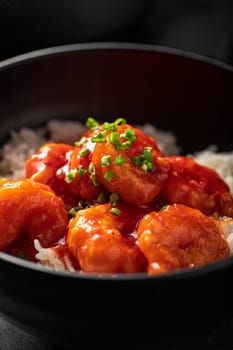 Portion of asian sweet and sour shrimp with rice