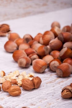 Nuts on white wooden background in studio photo