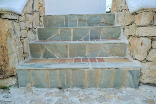 Outdoor, gray handmade stone staircase, daylight, nobody