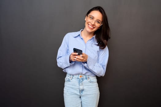 Woman use smartphone isolated on black