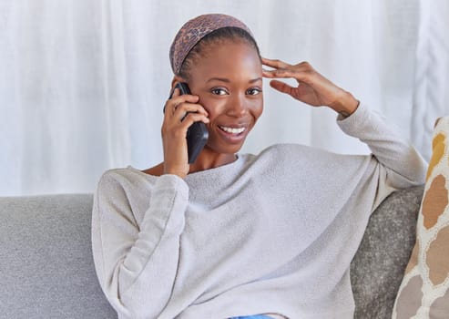 Black woman, portrait and phone call on home sofa with a smile for communication and connection. Female model with a smartphone for conversation with network and contact on living room couch to relax.