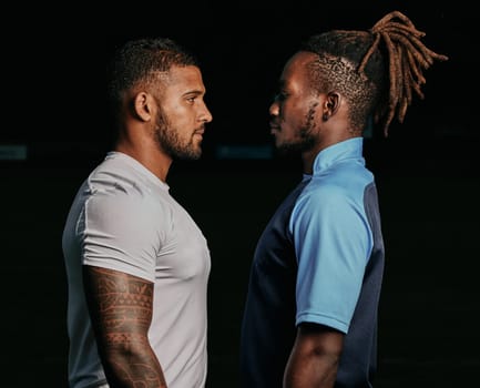 Profile, rival and a sports black man facing his opponent while looking serious in studio on a dark background. Face, challenge or conflict with a male athlete and competitor ready for competition