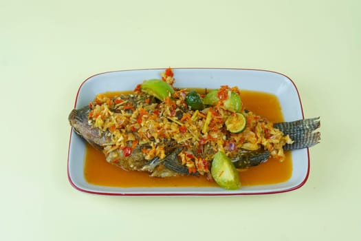 Pecak Ikan Mujair or Tialipa fish is a traditional Indonesian dish that originated from Betawi, Indonesia.