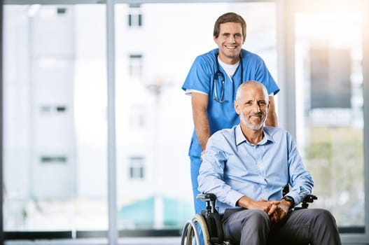 The quality of healthcare keeps me smiling. Portrait of a male nurse caring for a senior patient in a wheelchair