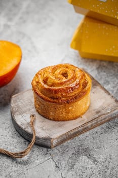 Fresh baked sweet swirl bun roll on serving board