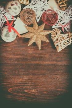Christmas decoration in vintage toning on wooden background