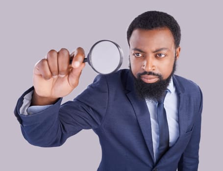 Business black man, magnifying glass and studio with focus for quality inspection, compliance and stop fraud. Businessman, inspector and auditor at company with attention for financial health at job