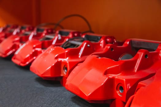 red car supports which are used in brakes lie in a row
