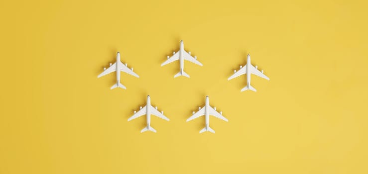 Aircraft travelling to different destinations on yellow background.