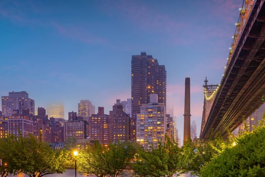 Manhattan city skyline cityscape of New York with Queen Bridge 
