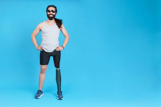 Happy man with a prosthesis in the leg and sunglasses