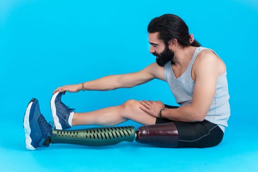 Man with a leg prosthesis stretching the femoral muscle