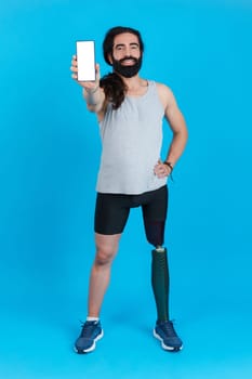 Smiling man with a leg prosthesis showing a mobile screen