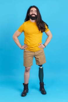 Man with a prosthesis on a leg smiling at camera