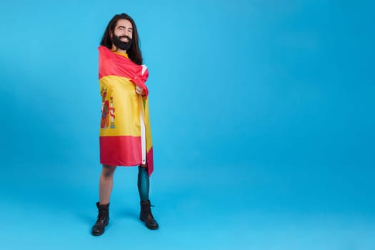 Man with prosthetic leg wrapped in a spanish national flag