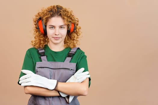 Woman carpentry worker with tools and work uniform