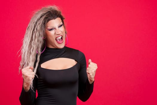 Passionate transgender person celebrating raising the fist
