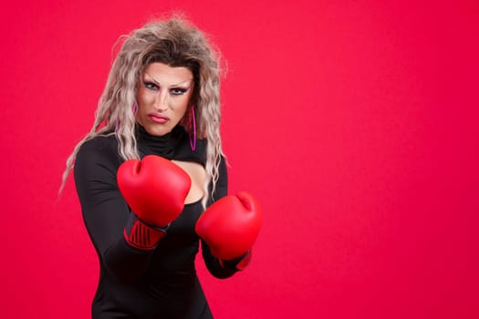 Transgender person with boxing gloves and agressive pose