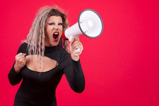 Angry transgender person shouting using a loudspeaker