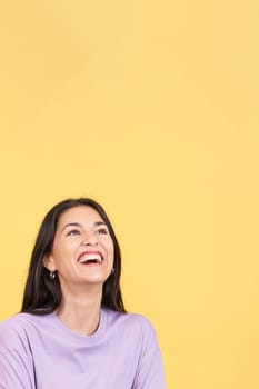 Hispanic woman laughing and looking up