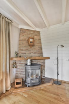a small stove in a room with a brick wall