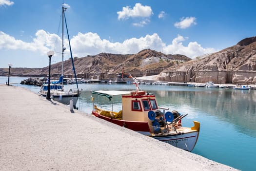 fishing boats moored at a pier in santorini island