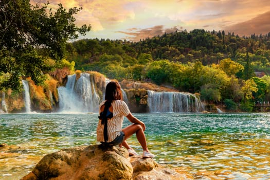 KRK waterfalls, woman watching waterfall Croatia Krk national park