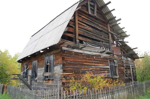 Old wooden abandoned house in the countryside