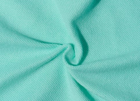 Cotton mint-colored fabric texture for making clothes