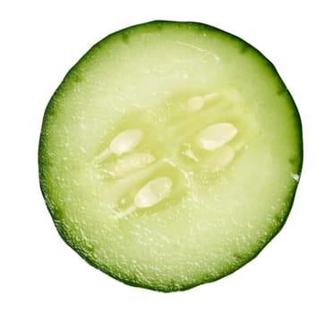 A round slice of fresh cucumber on a white isolated background, an ingredient for a salad.