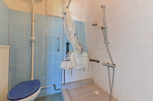 a small bathroom with a shower and a toilet