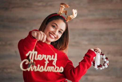 Christmas sign, happiness and woman portrait with xmas and festive season decorations. Wow, excited and isolated female with holiday celebration and a smile from winter celebrating and youth.