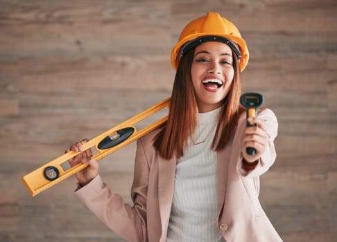 Engineer, business woman laugh and portrait of a property architect with construction tools. Safety helmet, stud detector and engineering gear for a home renovation project with female employee