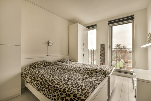 a bedroom with a leopard print bed