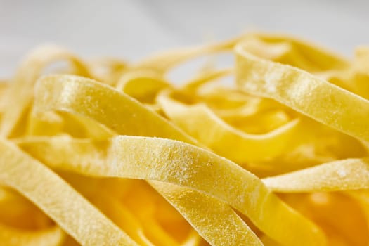 Raw fettuccine pasta detail