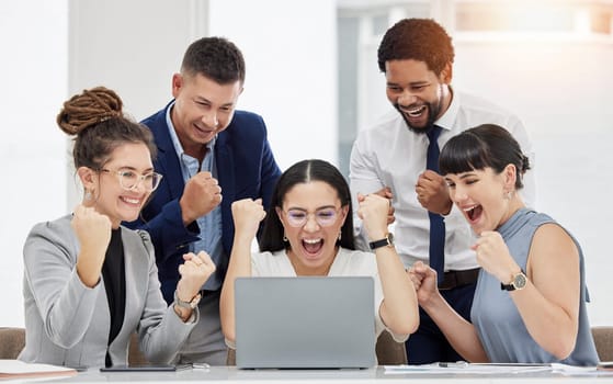 Business people, laptop and celebration for winning, promotion or bonus in teamwork at the office. Group of excited and happy employees in team victory, achievement or meeting success by computer.